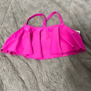 A pink swim top that can be easily paired with black bottoms